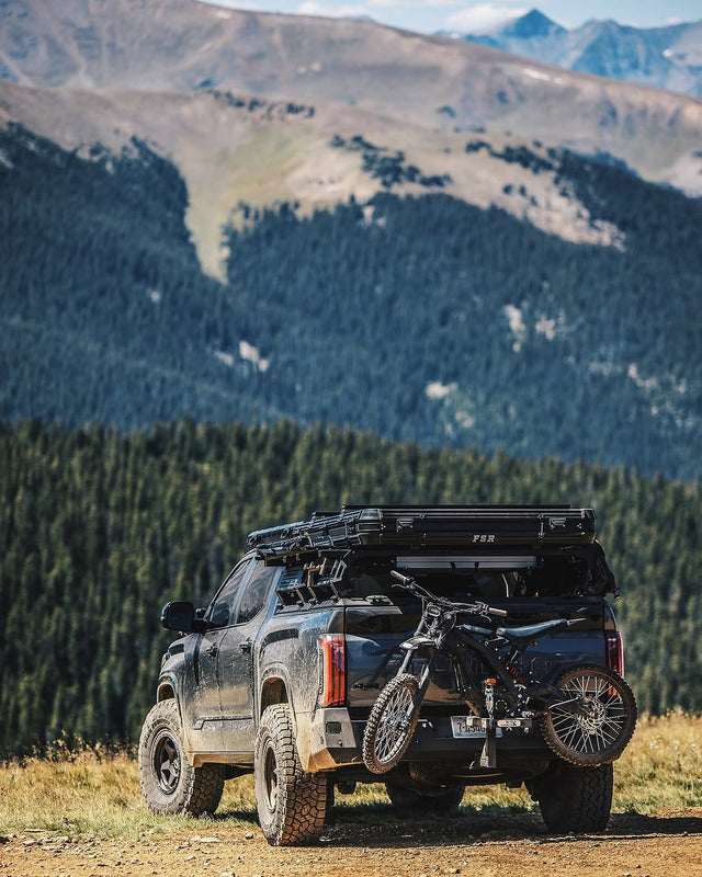 velocity volts charge carrier off-roading truck in the mountains