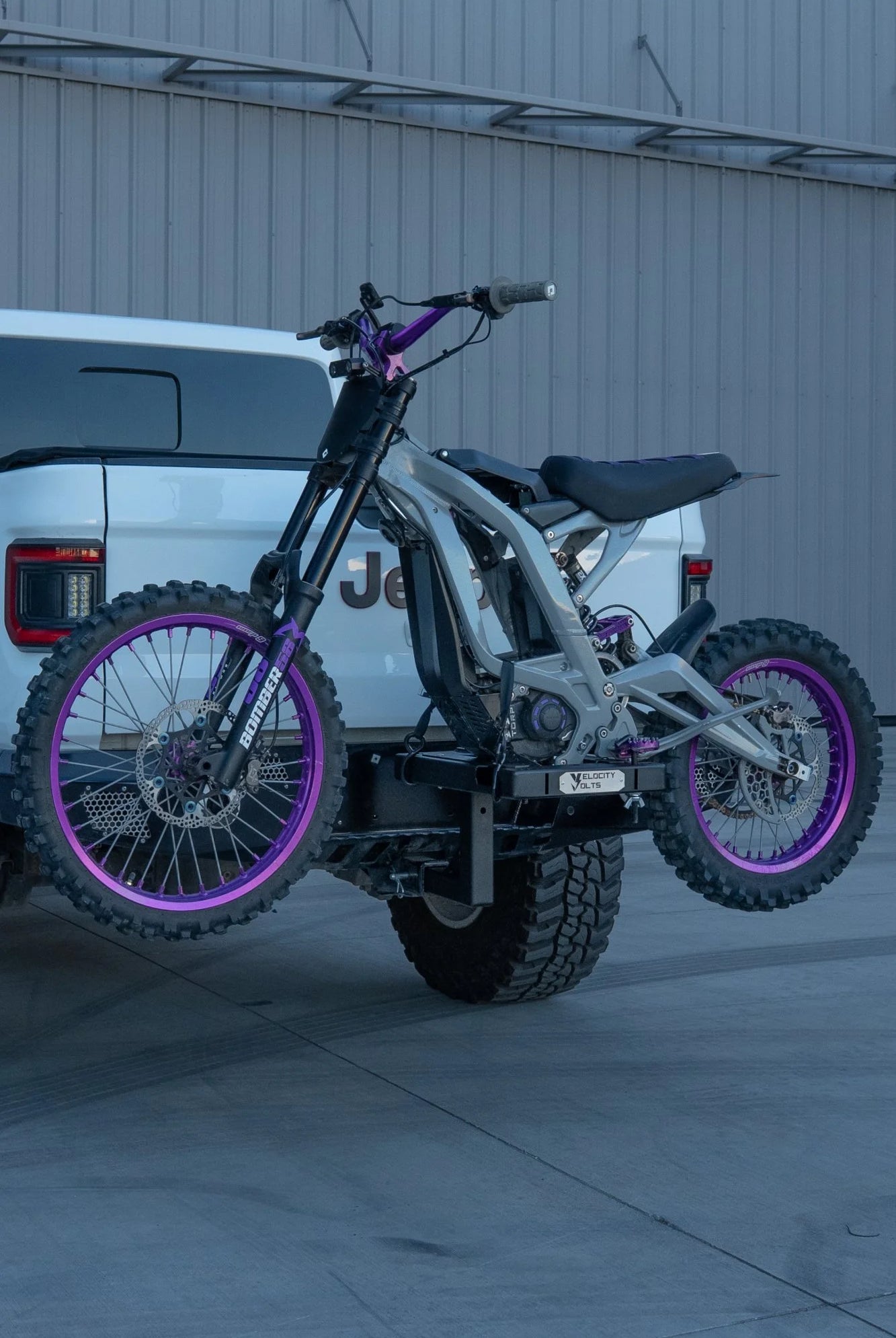 Surron Light Bee adjustable e-moto hitch rack mounted on a Jeep Gladiator