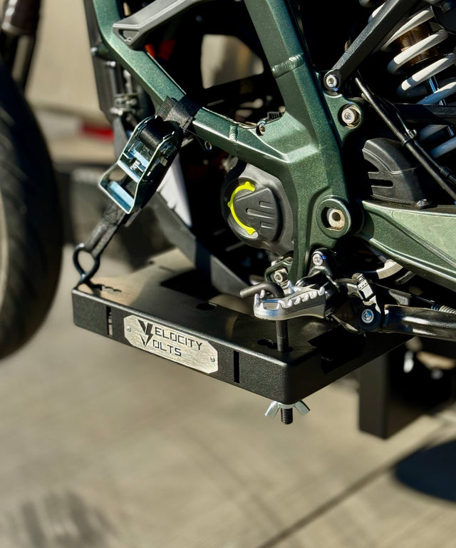 Close-up of an electric motorcycle sitting on the velocity volts charge carrier