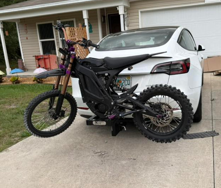tesla model 3 e-moto hitch charge carrier holding an eride pro 3.0