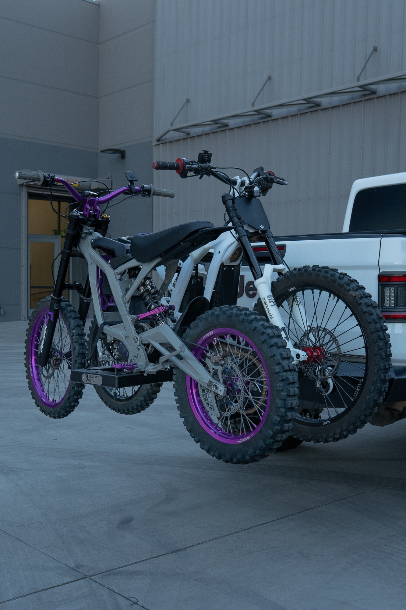 Surron Ultra Bee and Talaria e-moto hitch rack carrying two electric dirt bikes
