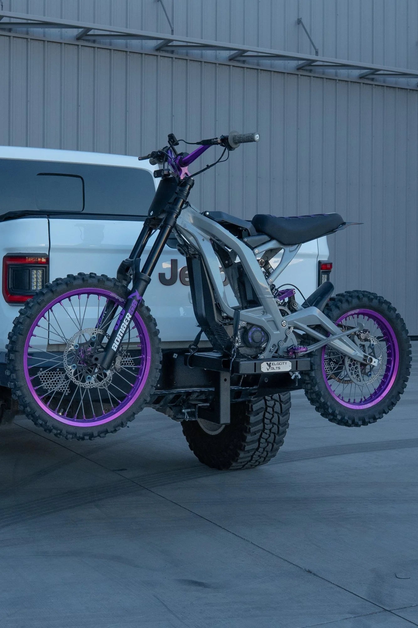 Surron Light Bee adjustable e-moto hitch rack mounted on a Jeep Gladiator