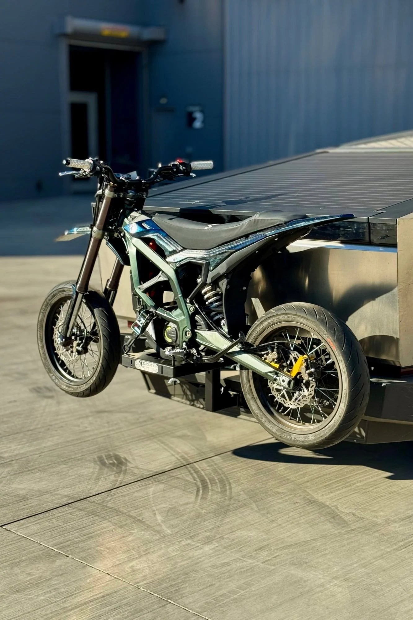 Modular electric dirt bike rack in  carrying a Surron Hyper Bee / Surron Ultra Bee on a Tesla Cyber Truck
